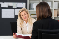 10617172-mature-businesswoman-discussing-to-her-assistant.jpg