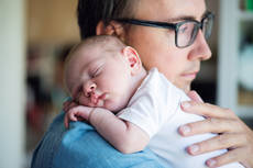 17608419-close-up-of-young-father-holding-his-newborn-baby-son.jpg