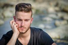 13222154-sad-or-worried-young-man-outdoors.jpg