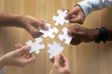 36223097-hands-of-diverse-team-members-assembling-jigsaw-puzzle.jpg